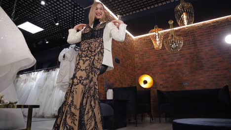 woman trying on an elegant dress in a boutique