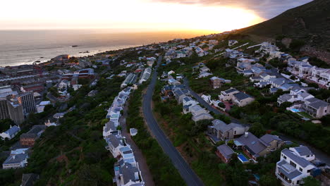 aerial cinematic drone sunrise simon's town small fishing town quite city cape town south africa early sunlight clouds table mountain fish hook muizenberg penguins forward movement