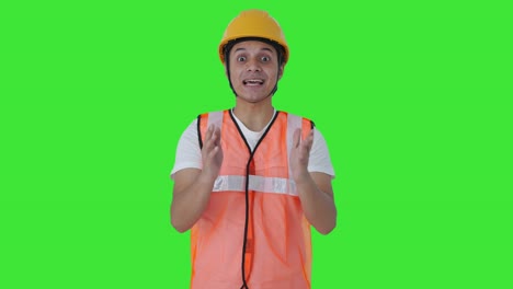 Happy-Indian-construction-labour-talking-to-someone-Green-screen