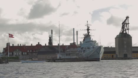 floating along the sea from right to left. view of old warship of the danish fleet in the harbor of copenhagen denmark.