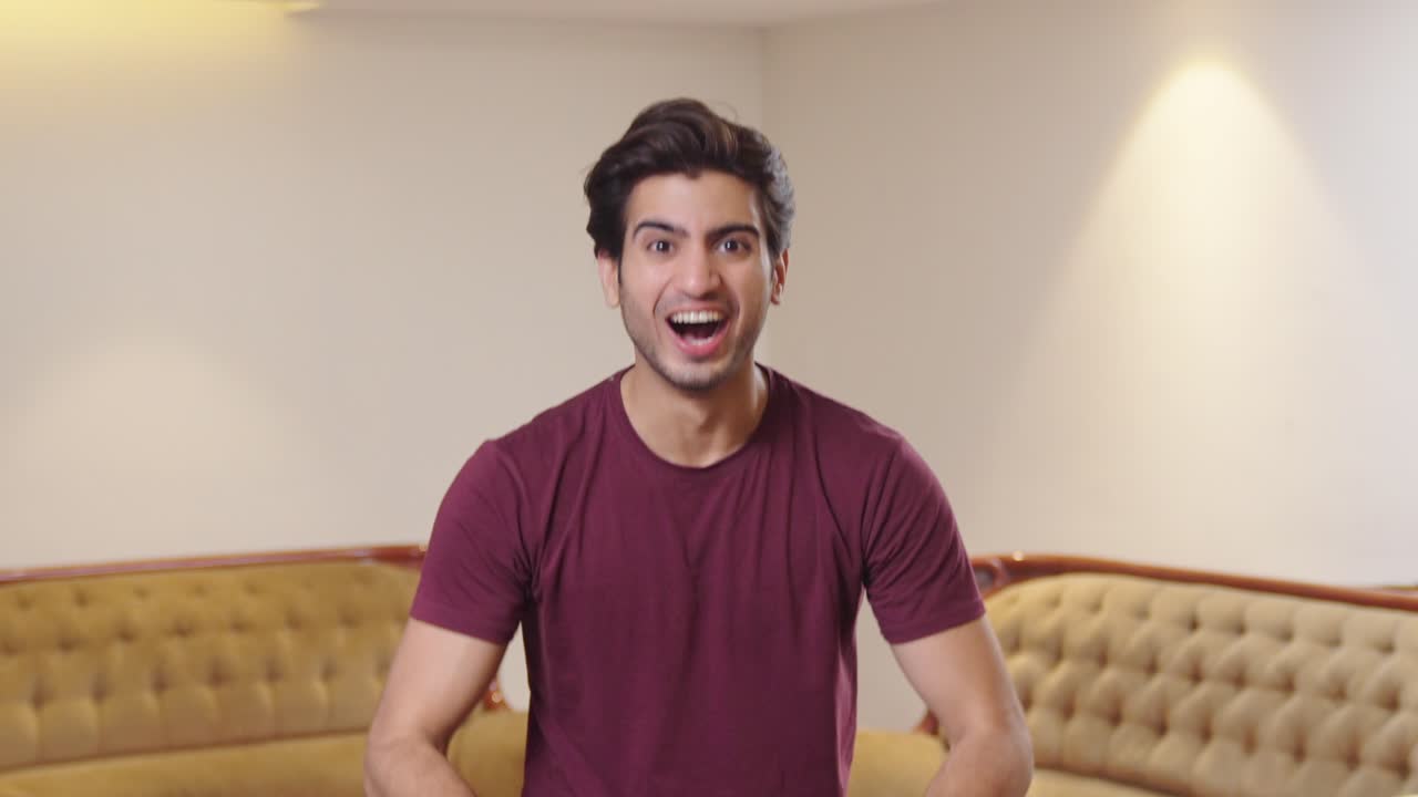 Excited Indian man celebrating and having fun