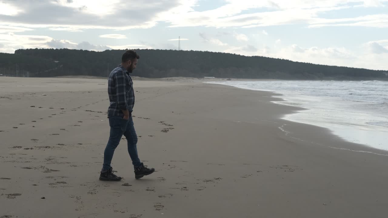 Lonely Man Standing on the Beach