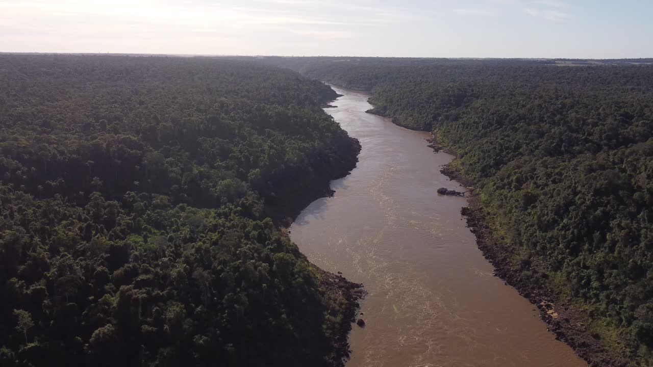 Iguazu River flowing in Amazon rainforest at border between Brazil and Argentina