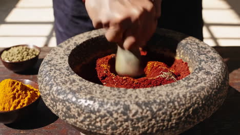 grinding spices in a mortar and pestle