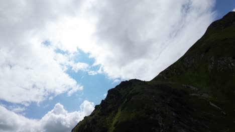 fpv drone flight over mountain peaks of slovakian high tatras in cloudy day