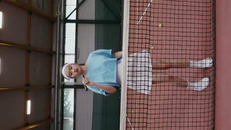 woman playing tennis indoor