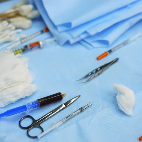 close up of the surgical instruments. scalpel and scissors and syringes and needles and clamps. instruments for the operation