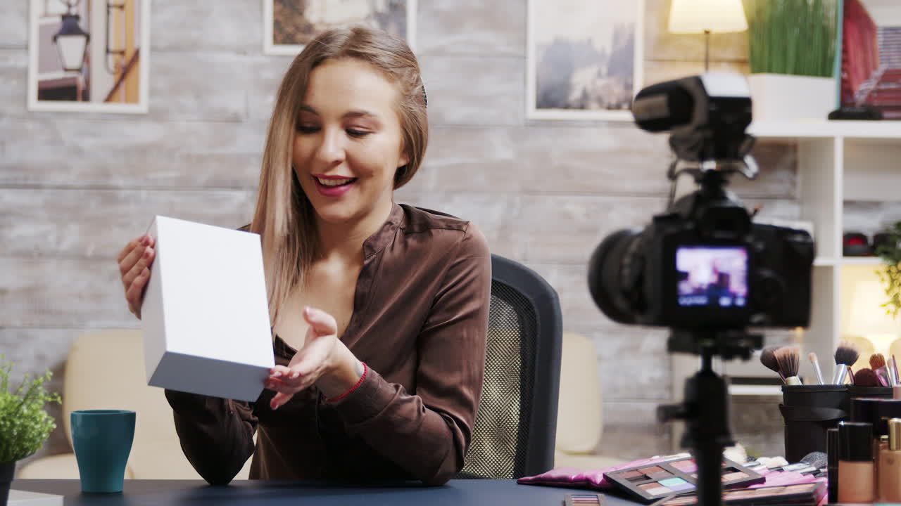 Woman Recording Beauty Vlog with a Product