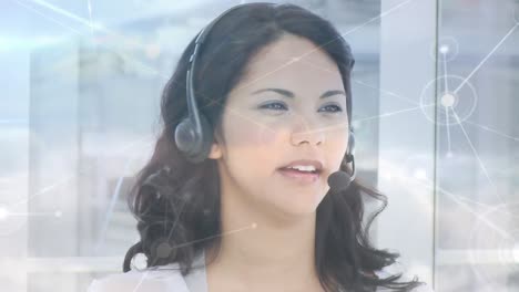 Animation-of-network-of-connections-over-business-woman-using-phone-headsets