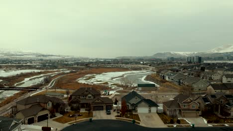 thanksgiving point golf course in lehi, utah and suburban neighborhood on a cold winter day - aerial flyover