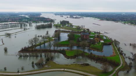 drone footage of slot loevestein and landscape in floodwaters around river waal, netherlands