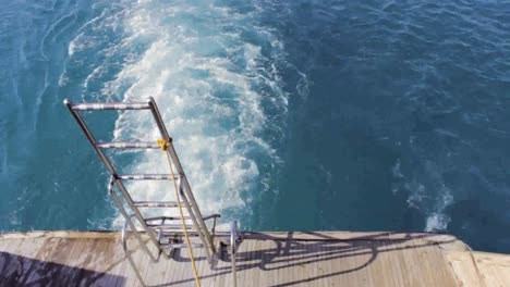 Travel-in-Egypt-Red-sea-with-stairs-behind-boat-for-scuba-diving