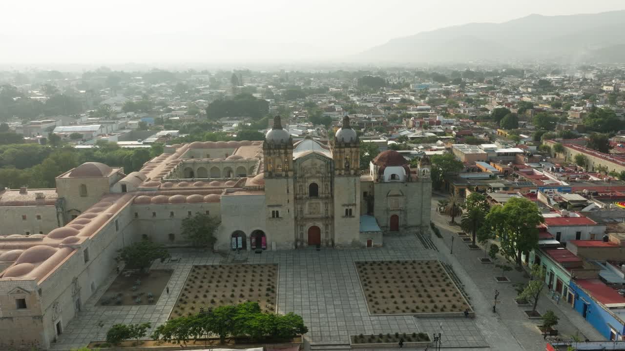 DRONE: LOW ORBIT SHOT OF SANTO DOMINGO CHAPEL IN OAXACA AT THE EARLY MORNING