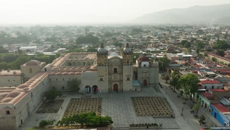 drone: low orbit shot of santo domingo chapel in oaxaca at the early morning