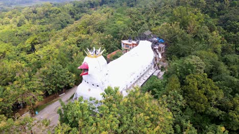 iconic chicken church on rhema hill in indonesia, aerial orbit view