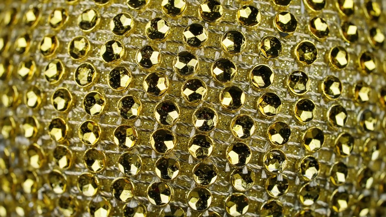 Sfondo scintillante di paillettes e glitter dorati