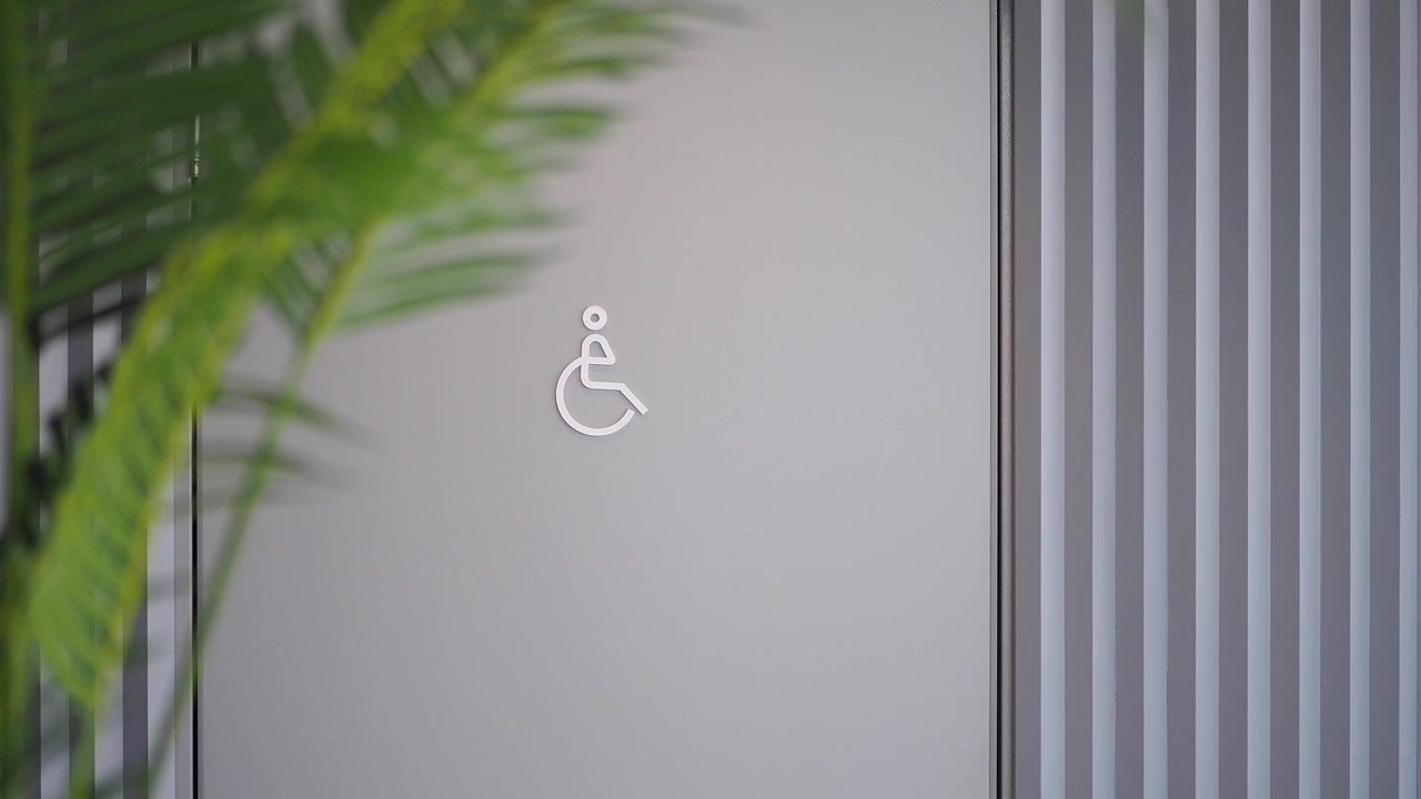Accessible Restroom Sign on Modern Office Door