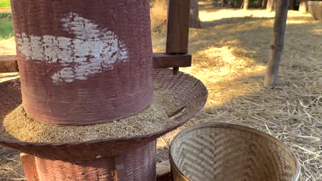 wooden mill processing rice in rural thailand