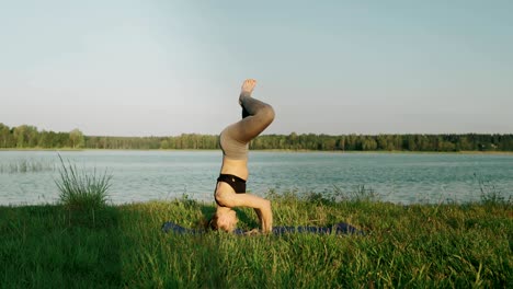 girl training in morning. pretty girl doing yoga and pilates outdoor at sunrise