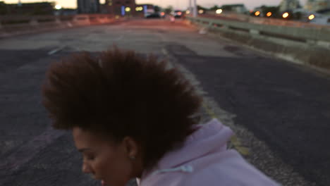 woman enjoying a run at sunset in an urban setting