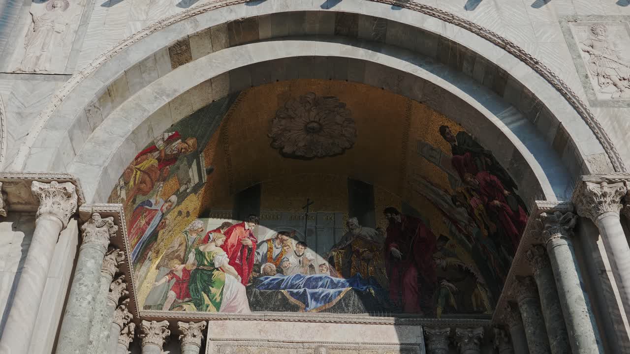 Close up on Historic Art Inside Arch of St Marks Cathedral Venice Italy