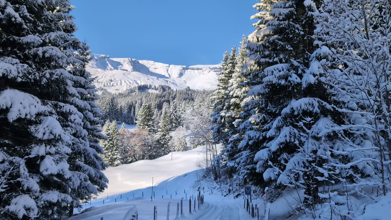 Snow covered path in mountains in the winter, Grindelwald Switzerland