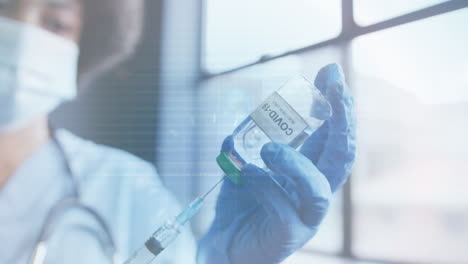 animation of motherboard and data processing over doctor in mask and gloves preparing covid vaccine