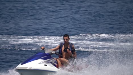 Young-man-turning-on-Jetski-in-mediterranean-sea-in-Slow-motion-action-shot