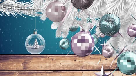 animation of christmas tree with decorations over snow falling and baubles on blue background