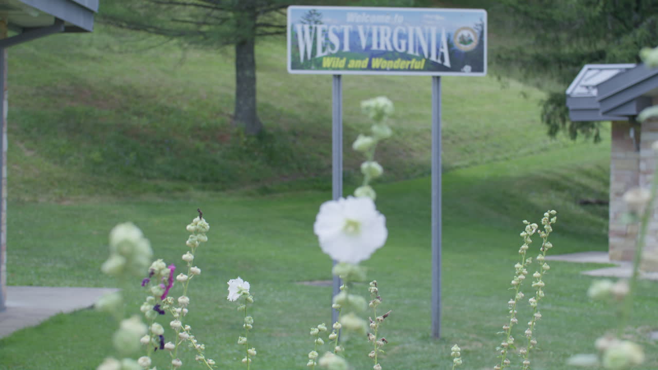 Welcome to West Virginia Sign with Flowers