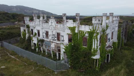 aerial view orbiting soldiers point house abandoned overgrown white castle secured mansion hotel