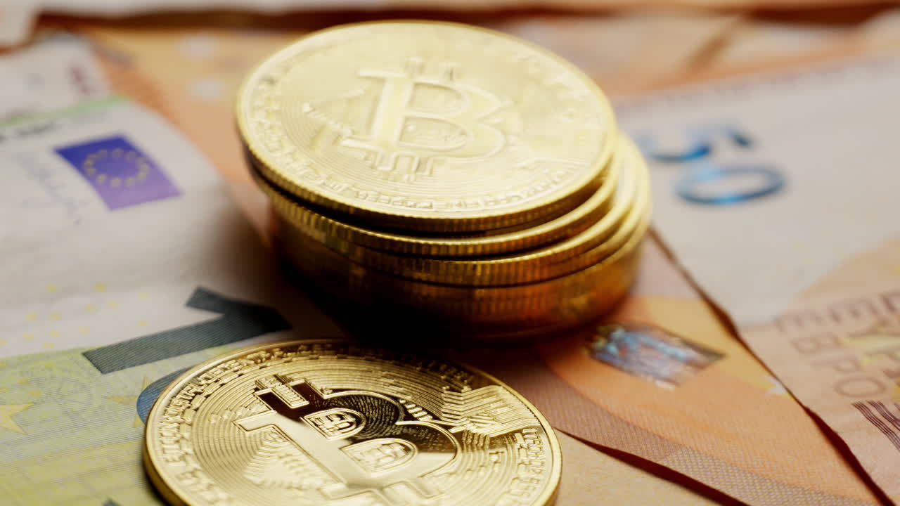 Bitcoin coin dropping onto euro bills, symbolizing cryptocurrency and traditional finance