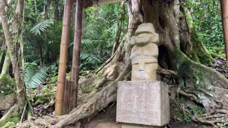 indigenous totem carved in stone in the jungle of san agustin archaeological park