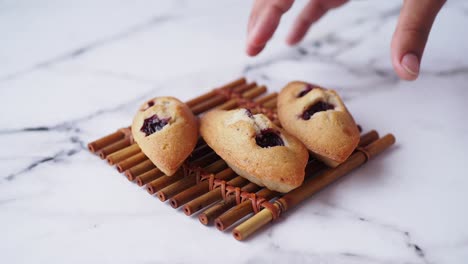 cherry pastries on a bamboo mat