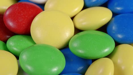 sweets in the form of multi-colored pebbles, poured with colored glaze.