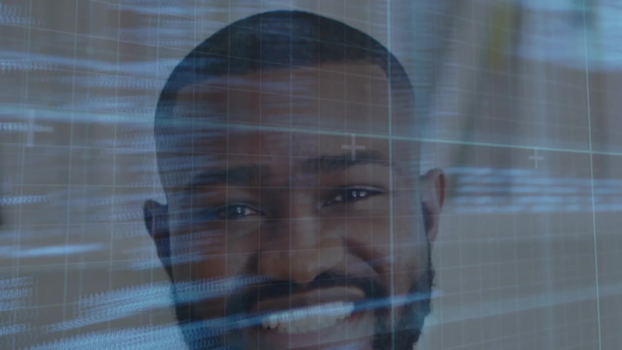 Animation of data processing on digital screen over happy african american male doctor