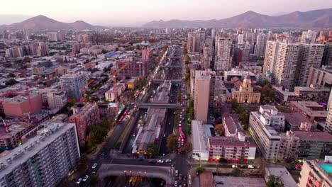 flyover central highway road with santa ana metro station in between lanes, heavy traffic rush hour, santiago de chile