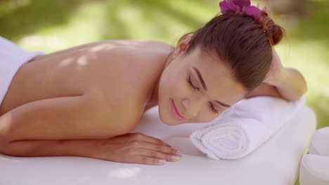 lovely young woman relaxing at a spa