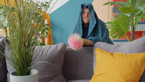 angry man cleaning a colorful living room