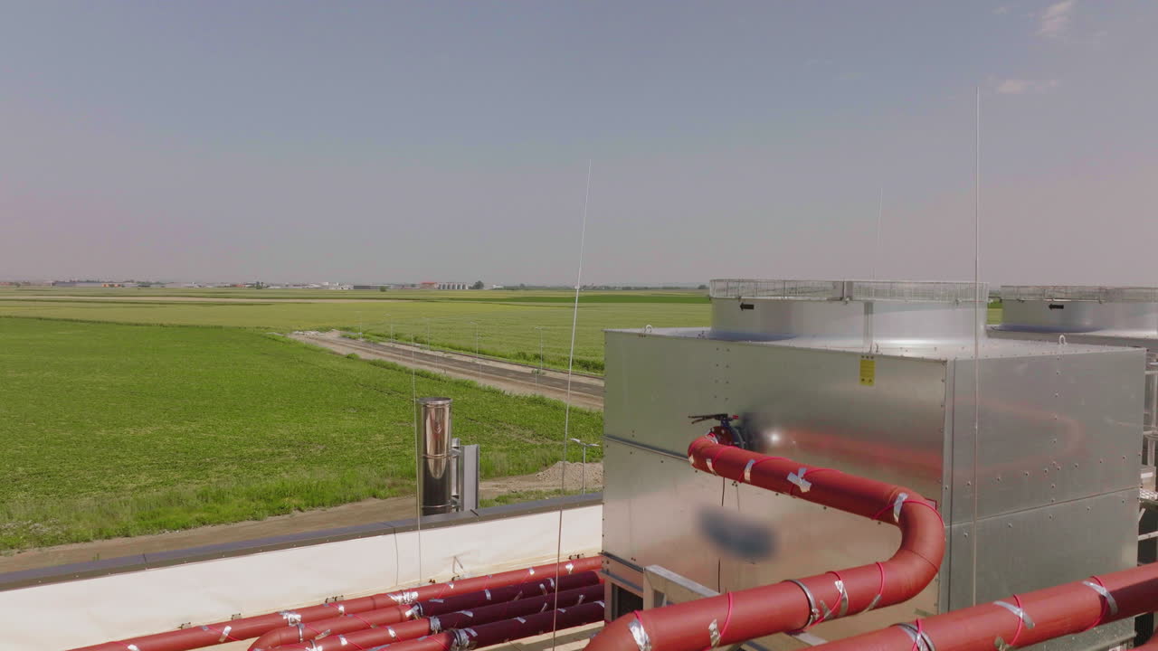 Industrial Facility with Cooling Towers and Agricultural Landscape