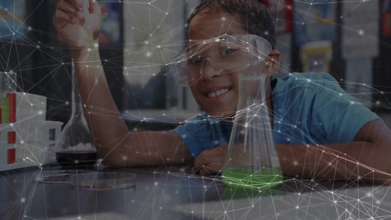 Boy reaching for pipette and dipping into vial to test science reaction, network overlay appearing