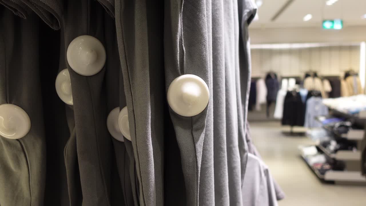 Clothes on a Rack with Anti-theft Devices in a Store