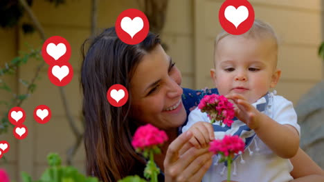 animación de iconos de corazón sobre madre caucásica con bebé