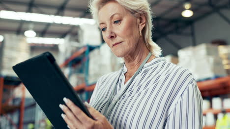 Senior-woman,-tablet-and-inventory-at-warehouse