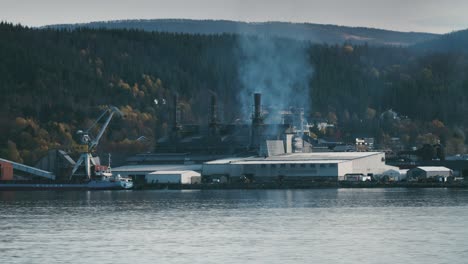 a working ferrosilicon production plant on the shore of the fjord