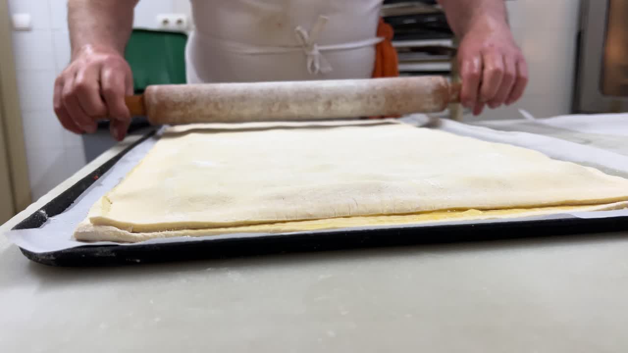 Bakery scene: elaboration of a traditional handmade tomato empanada