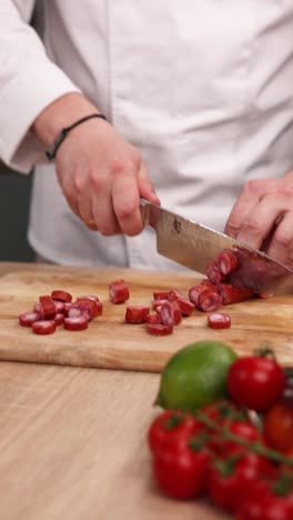 chef chopping sausage