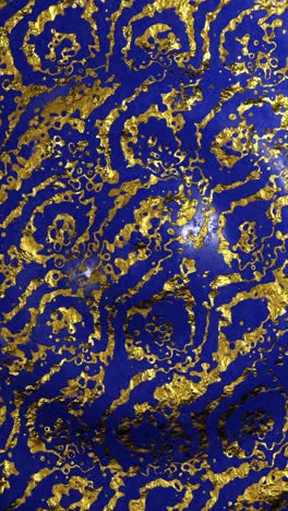 blue wavy background with gold flecks. vertical looped video