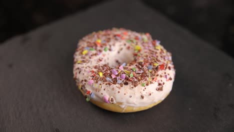 close-up of a glazed donut with sprinkles