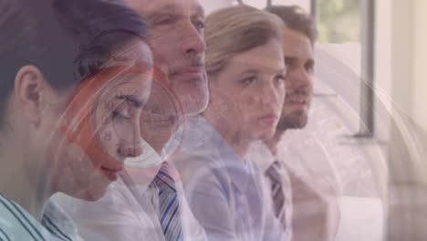 composite video of watch mechanism against diverse businesspeople having a meeting at office